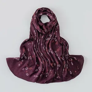 Detailed view of the dark purple pleated floral silk scarf showcasing fine texture.