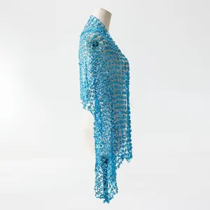 Detailed side view of a sparkling blue sequin fringe shawl, elegant party embroidery.