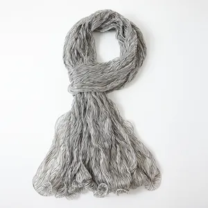 Close-up detail of the lightweight pleated striped sheer scarf fabric texture and elegant drape.