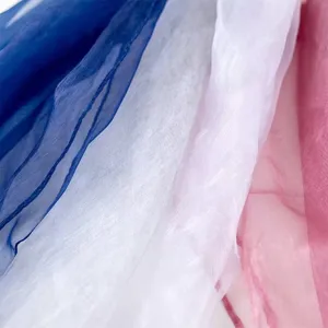 Close-up view of soft colorful chiffon fabric, lightweight sheer texture for elegant details.