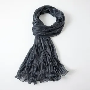 Close-up detail view of the dark gray pleated metallic crinkle scarf, lightweight sheer fabric.