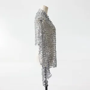 Detailed side view of silver sequin tassel shawl, elegant evening party wear wrap for women.