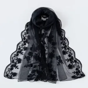 Exquisite black lace embroidered scarf detail, lightweight mesh floral vintage shawl close-up.