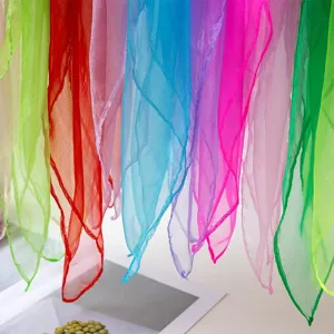 Detail view of colorful chiffon juggling scarves, soft sheer dance square handkerchief.