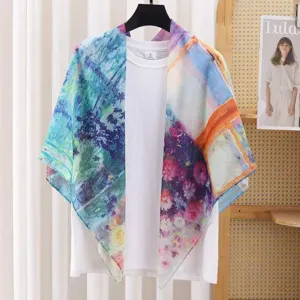 Artistic print square scarf detail showing delicate impressionist oil painting design.