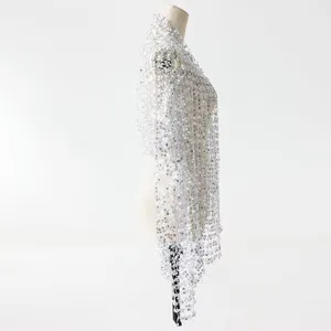 Silver sequin tassel shawl detail shot, sparkling mesh embroidery design for evening dress.