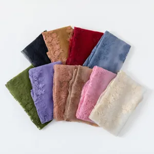 Detailed view of French vintage floral lace embroidered scarves in multiple vibrant colors.