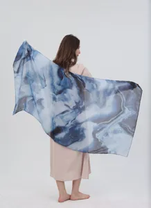 Elegant blue gradient watercolor printed women scarf shawl showing detailed artistic pattern.