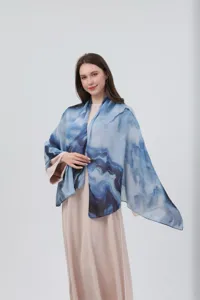 Detailed shot of a blue watercolor gradient women shawl showing soft texture and print design.