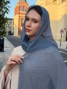 Lightweight blue solid color bubble scarf detail shot, perfect for summer sun protection.