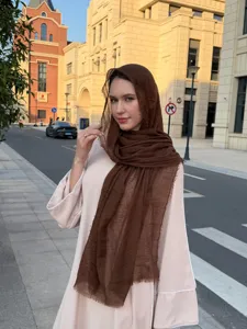 Detailed view of the solid color bubble scarf and lightweight shawl for daily wear or travel.