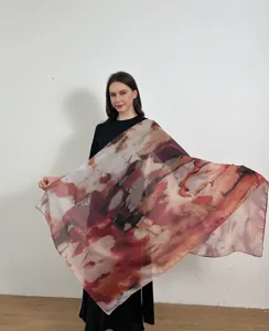 Detail view of large abstract watercolor print shawl, showing rich gradient red tones pattern.