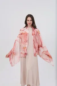 Close-up detail of the pink watercolor gradient printed scarf showing smooth texture.