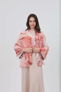 Details of women watercolor gradient printed shawl cape scarf, elegant fashion apparel piece.