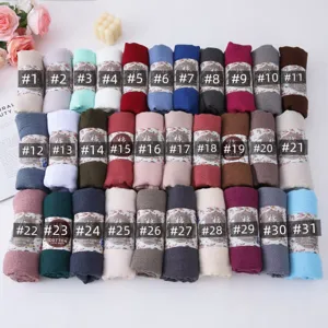 Detailed view of solid color bubble scarves in multiple color options, soft fabric.