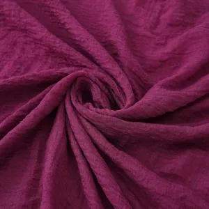 Detailed view of the solid color bubble scarf fabric texture in deep purple, soft and lightweight.