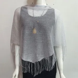 Silver metallic fringe shawl detail, hollow-out summer cape, lightweight woven texture.