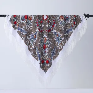 Detailed close-up view of traditional ethnic floral print tassel square scarf shawl.