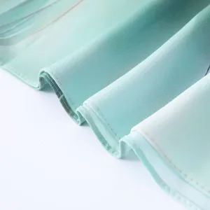 Satin polyester fabric detail shot, watercolor tie-dye gradient texture, scarf close-up