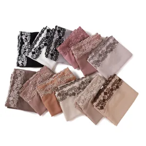 Chiffon embroidered lace edge scarf detail view close up showing texture and floral pattern.