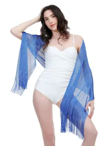Close-up of the shimmering metallic tassel shawl, elegant evening wear or sun protection scarf.