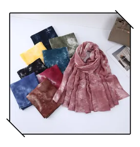 Detailed view of colorful tie-dye scarves, showing delicate texture and gradient color style.