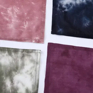 Close-up detail shot of soft tie-dye rayon fabric texture and neat edge stitching design.