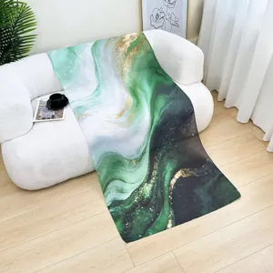 Detail view of green watercolor marble print fashion scarf shawl, soft and elegant accessory.