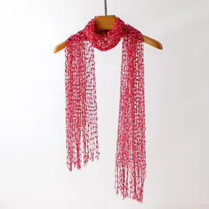 Details of the open-knit sequin tassel long scarf, delicate hollow design and lightweight texture.
