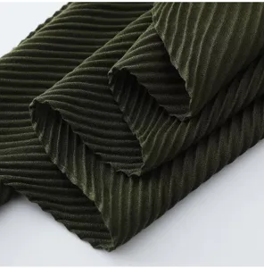 Dark green pleated square scarf detail, elegant texture, soft material for women.