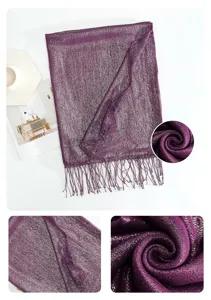 Detailed view of metallic purple tassel scarf, showing soft fabric texture and fringe trim.
