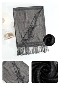 Detailed view of women shimmer metallic tassel scarf, elegant black evening shawl for spring.