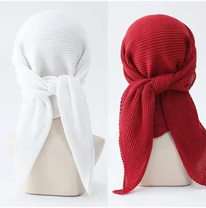 Detailed view of women pleated solid color square headscarf hijab, soft fabric detail display.