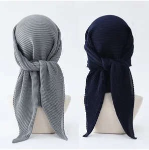 Detailed view of women solid pleated square hijab scarf, elegant imitation linen turban accessory.