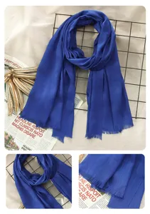 Blue cotton linen scarf detail, soft texture and fringed edge, stylish daily accessory.