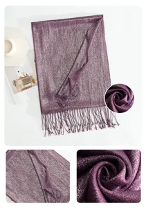 Purple metallic shimmer fringe scarf detail close-up showing soft textured fabric quality.