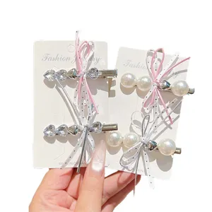 Mooie haarspelden met strik parel en strass steentjes modieuze haaraccessoires voor dames.