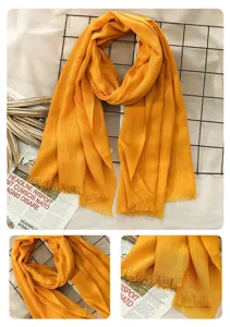 Detailed view of bright yellow cotton linen scarf with elegant fringe design and soft texture.