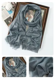 Detailed view of shimmer metallic long scarf featuring delicate fringe and soft rayon fabric.
