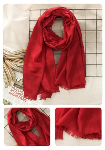 Red cotton linen scarf detail, soft texture, elegant fringe edge, perfect autumn accessory.