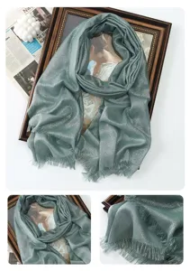 Detailed view of metallic glitter shimmer shawl scarf with fringe, soft textured fabric.