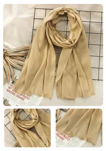 Detailed view of women cotton linen solid color scarf texture and fringe detail.