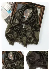Detailed view of the metallic shimmering scarf fabric texture and exquisite fringe edges.