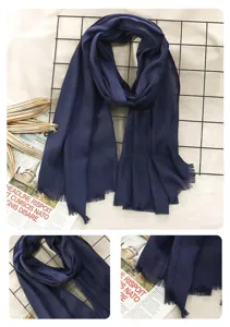 Navy blue cotton linen scarf detail, soft fabric texture with delicate fringe edge design.