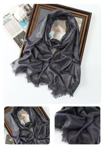 Metallic shimmering scarf detail, long shawl with fringe, elegant fabric closeup.
