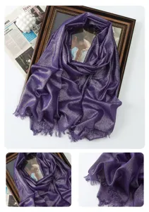 Detail view of the purple metallic glitter scarf featuring soft shimmering fabric and fringe.