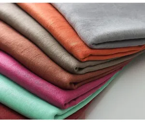 Solid color linen scarf closeup showing rich texture and multiple vibrant color options.