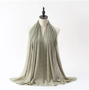 Chiffon pearl hijab shawl detail view, elegant sage green Islamic long headscarf for women.