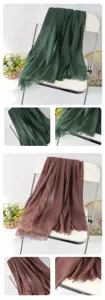 Solid color linen scarf detail view, showing soft fabric texture and elegant fringe edges.