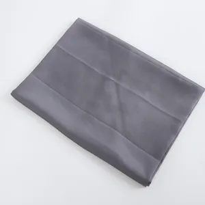 Grey satin scarf fabric detail view, smooth and soft texture showing premium quality.